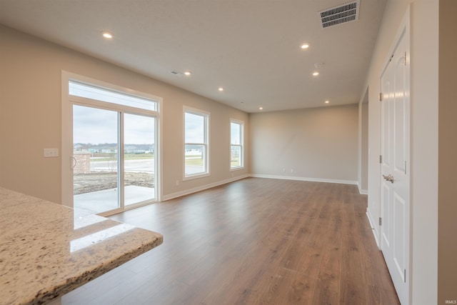 unfurnished room featuring hardwood / wood-style flooring