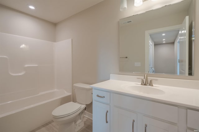 full bathroom with wood-type flooring, vanity, shower / bath combination, and toilet