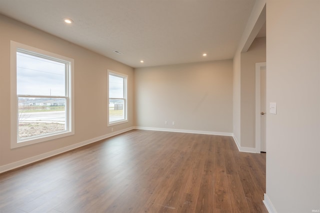 empty room with hardwood / wood-style floors