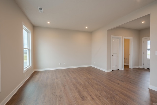 empty room with hardwood / wood-style floors