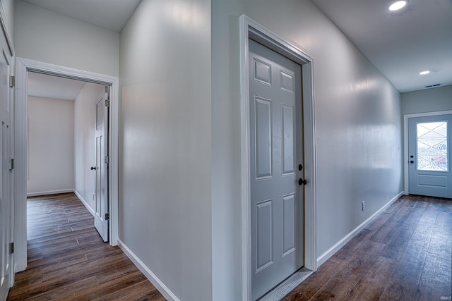 hallway featuring dark wood-type flooring