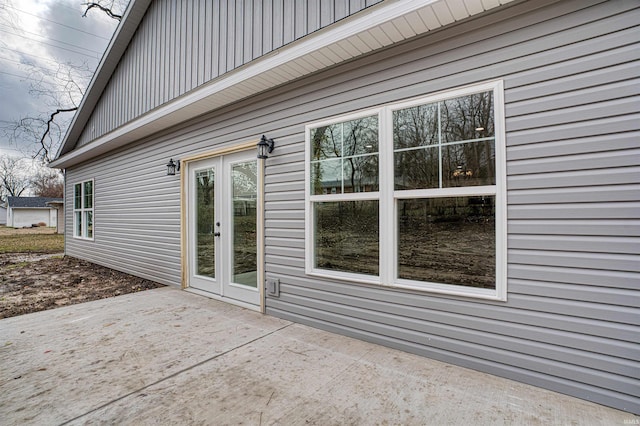 view of property exterior featuring french doors and a patio area