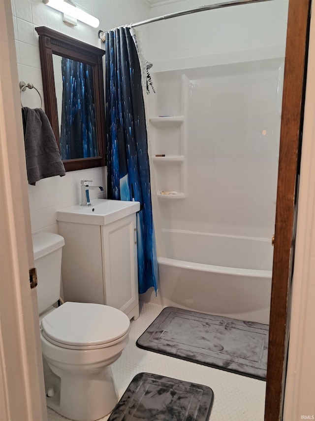 full bathroom with vanity, toilet, tile patterned flooring, and shower / tub combo