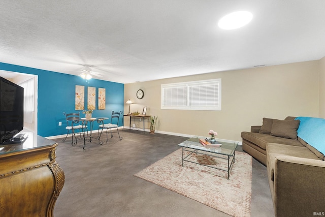 living room with concrete floors and ceiling fan