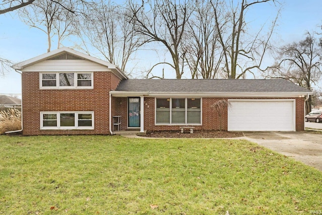 split level home featuring a front yard and a garage