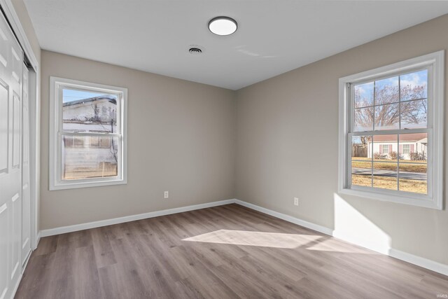 unfurnished room featuring light hardwood / wood-style flooring