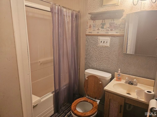 full bathroom featuring shower / bath combo, toilet, and vanity