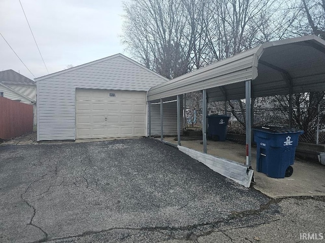 garage featuring a carport