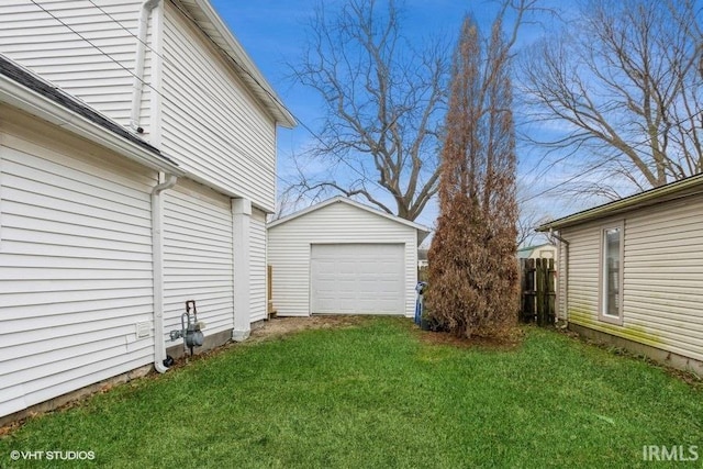 view of yard with an outbuilding and a garage