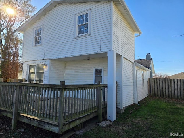 back of house featuring a deck