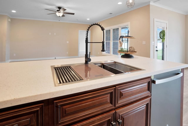 kitchen featuring ornamental molding, dark brown cabinets, ceiling fan, sink, and dishwasher