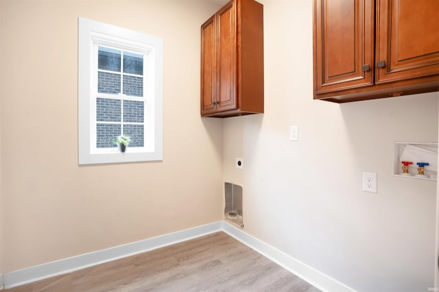 laundry area with cabinets, washer hookup, light hardwood / wood-style flooring, and electric dryer hookup