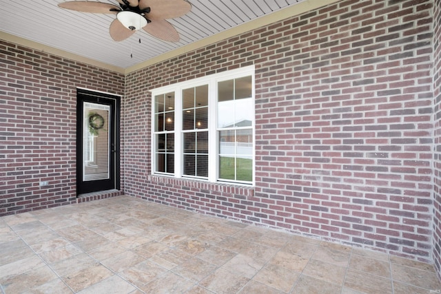 doorway to property featuring ceiling fan