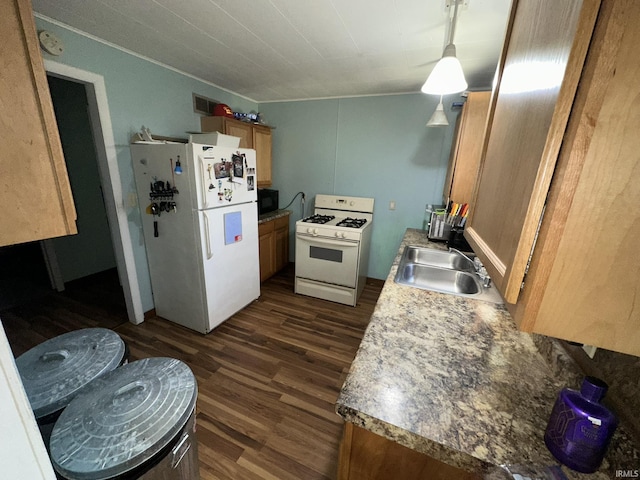 kitchen with sink, dark wood-type flooring, and white appliances