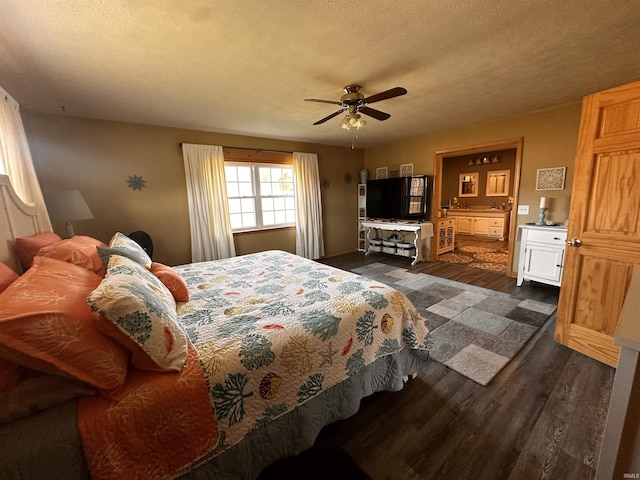 bedroom featuring ceiling fan, dark hardwood / wood-style floors, and a textured ceiling