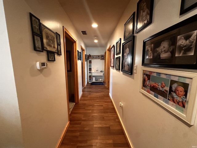 hall with dark hardwood / wood-style floors