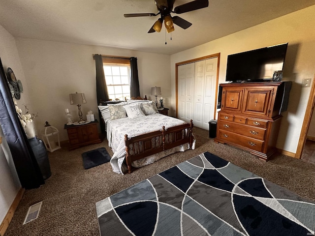 carpeted bedroom featuring ceiling fan and a closet