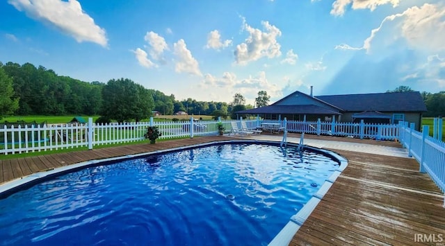 view of swimming pool featuring a wooden deck