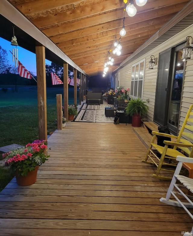 wooden terrace with a water view