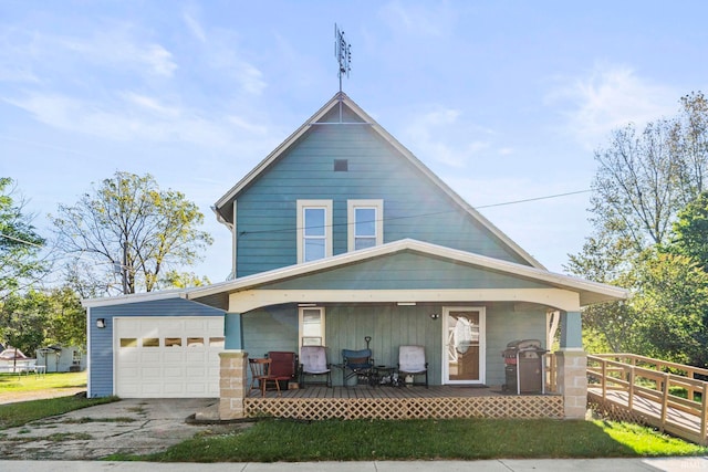 view of front of property with a porch and a garage