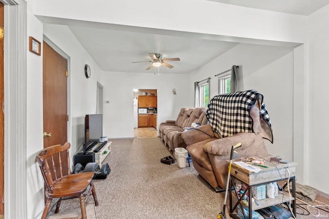 carpeted living room featuring ceiling fan