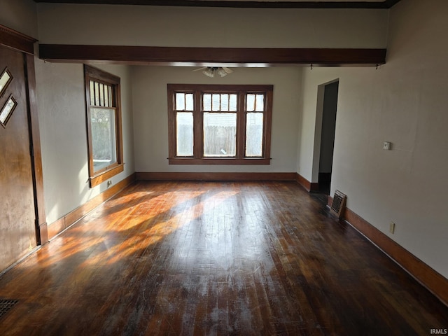 spare room featuring ceiling fan and dark hardwood / wood-style flooring