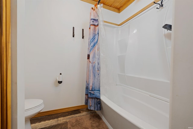 bathroom with toilet and shower / bath combo with shower curtain