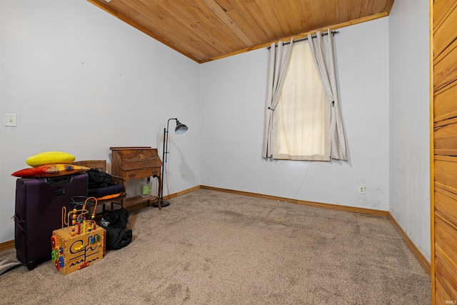 interior space featuring wooden ceiling and carpet floors