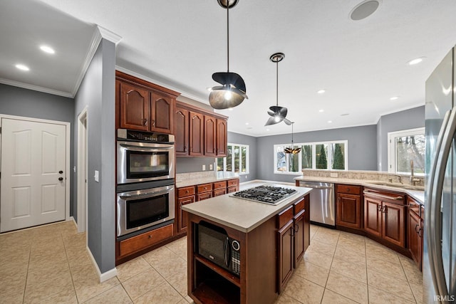 kitchen with kitchen peninsula, crown molding, decorative light fixtures, light tile patterned floors, and appliances with stainless steel finishes