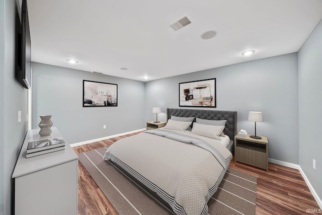 bedroom featuring dark hardwood / wood-style flooring