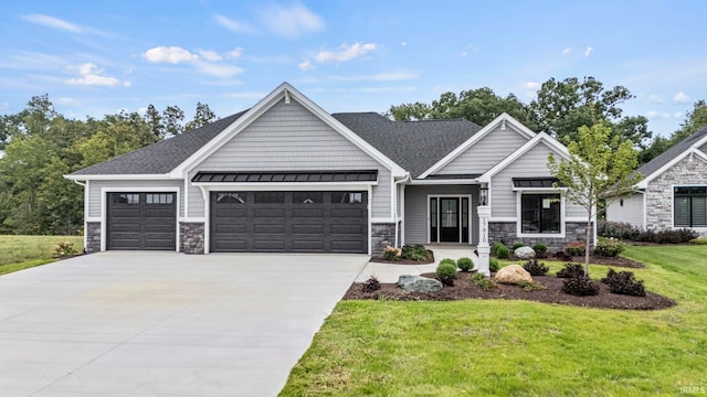 craftsman house with a front yard and a garage