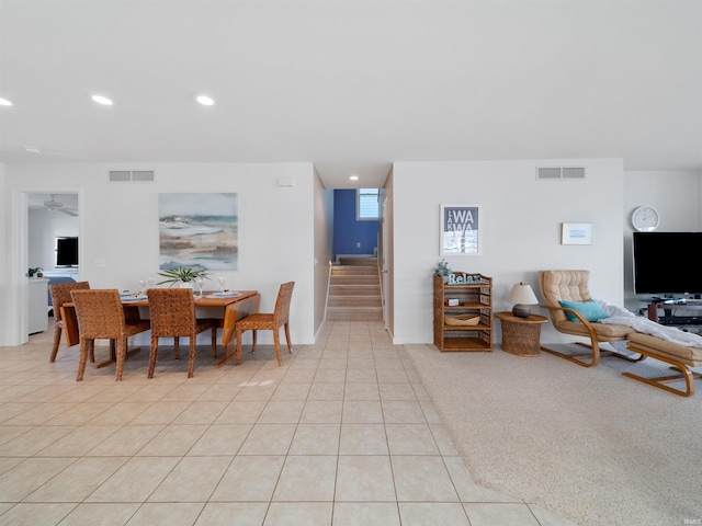 dining room featuring ceiling fan and light tile patterned floors