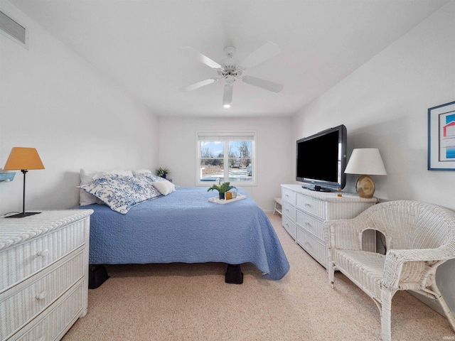 bedroom with light carpet and ceiling fan