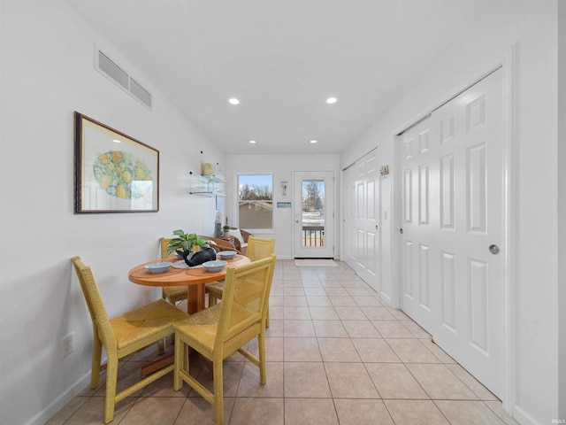 dining space with light tile patterned flooring