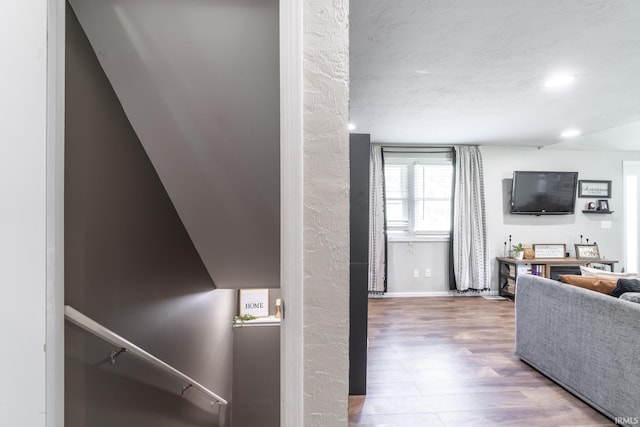 interior space with hardwood / wood-style floors and a textured ceiling