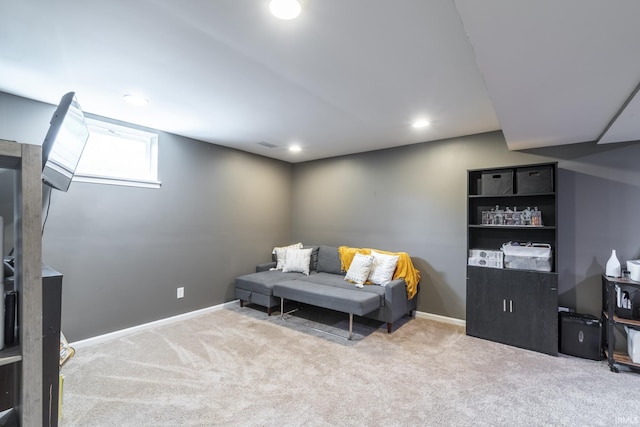 sitting room featuring light colored carpet