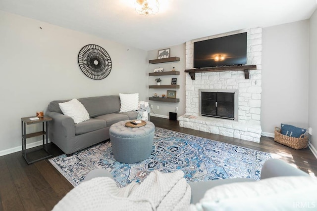 living room featuring a fireplace and dark hardwood / wood-style floors