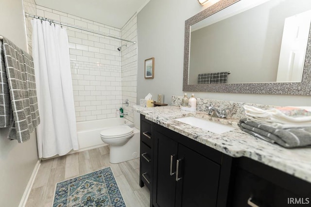 full bathroom featuring toilet, vanity, shower / bath combination with curtain, and hardwood / wood-style flooring