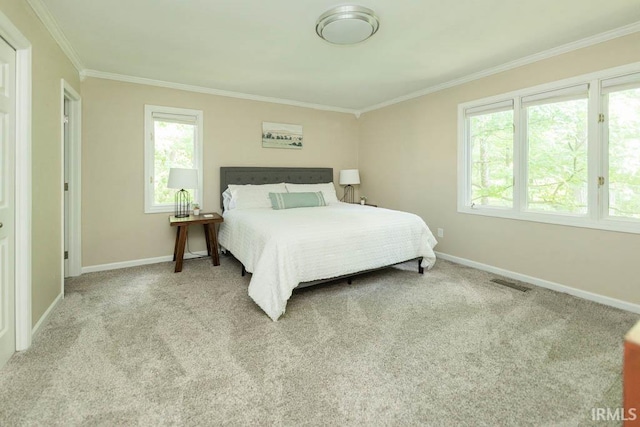 bedroom featuring light carpet, multiple windows, and crown molding