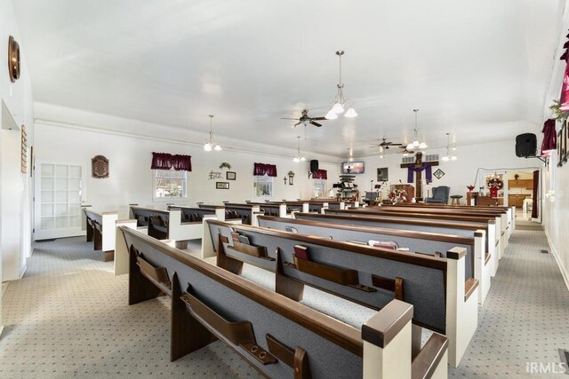 dining room featuring light carpet and ceiling fan