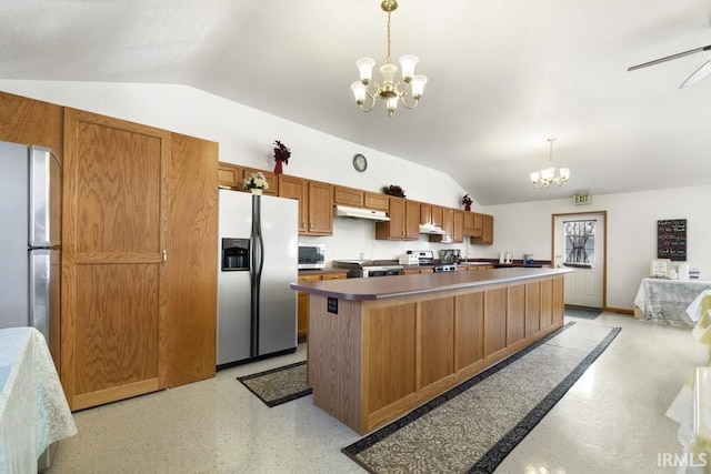 kitchen featuring stainless steel refrigerator, a center island, hanging light fixtures, stainless steel fridge with ice dispenser, and vaulted ceiling