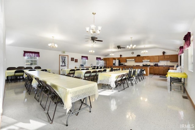 dining room with ceiling fan with notable chandelier