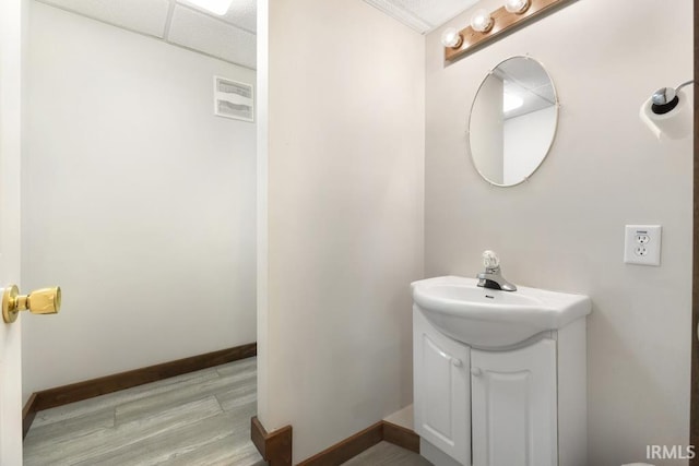 bathroom with vanity and hardwood / wood-style flooring