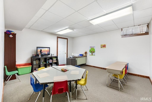 game room featuring carpet flooring and a paneled ceiling