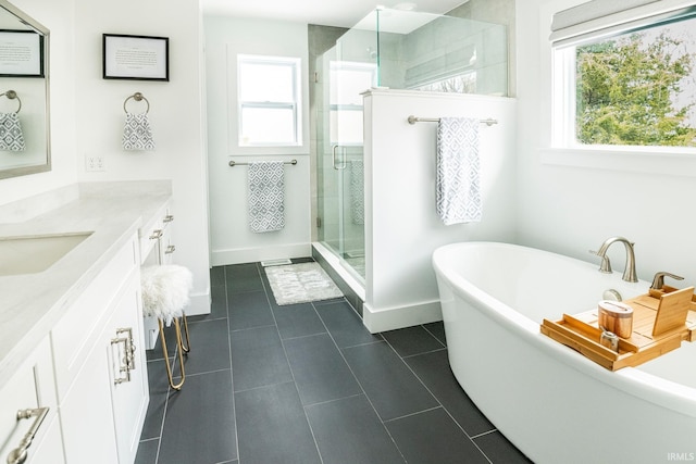 bathroom featuring vanity, tile patterned floors, and independent shower and bath