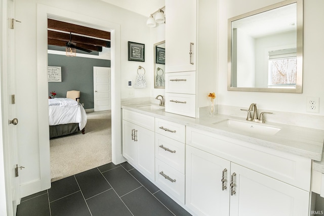 bathroom featuring beamed ceiling, vanity, and tile patterned floors