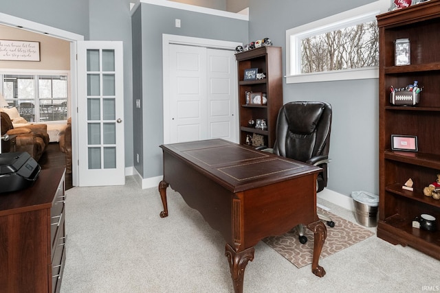 office area featuring light carpet and french doors