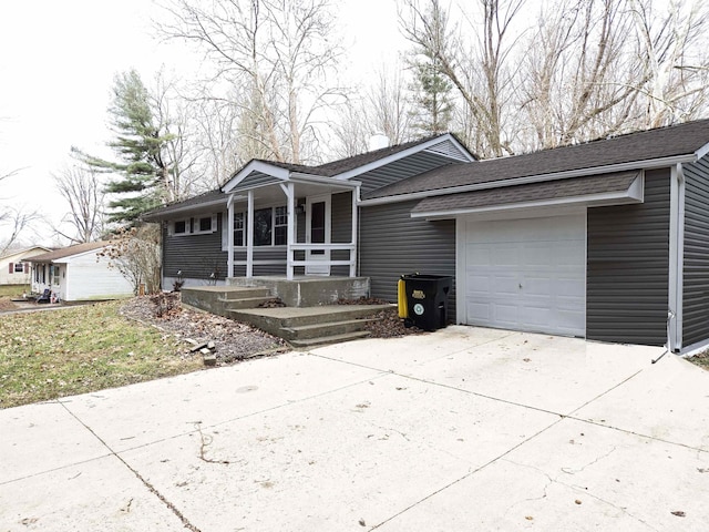 view of front of house featuring a porch and a garage