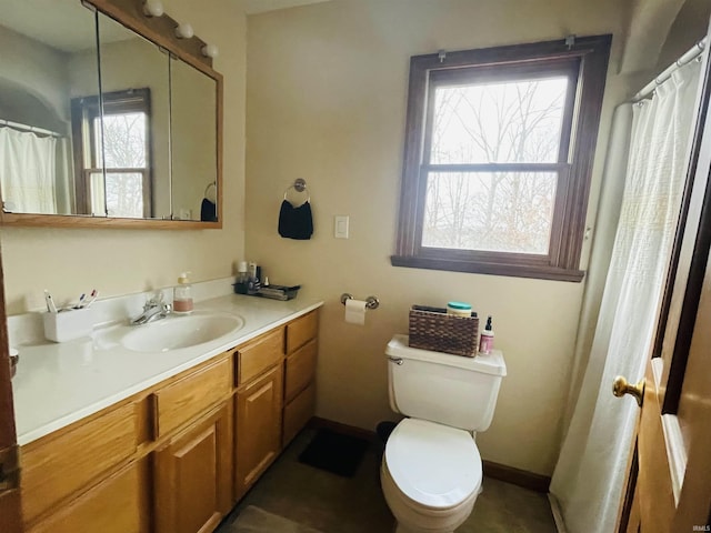 bathroom with vanity and toilet