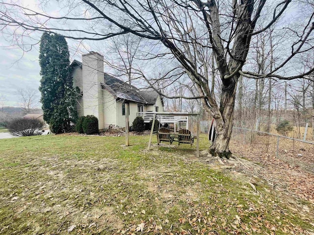 view of yard featuring a wooden deck